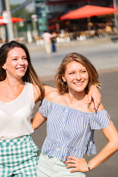 Two young girlfriends outside near each other - Valokuva, kuva