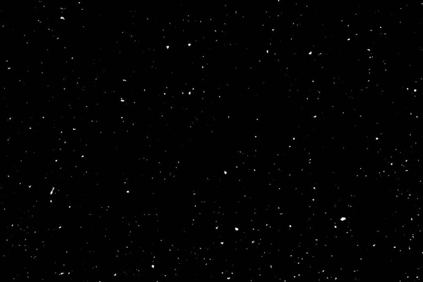 Caótico bokeh blanco sobre un fondo negro, manchas de luz textura, abstracción, caída de nieve, cielo estrellado - Foto, imagen