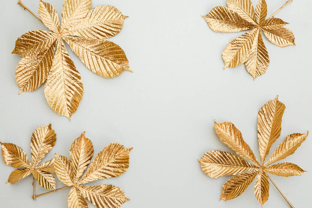 Gold leaf design elements around the edge of the frame. Frame of golden leaves. - Foto, Imagen