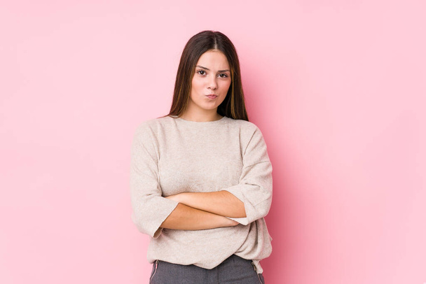 Young caucasian woman posing isolated frowning face in displeasure, keeps arms folded. - Photo, Image