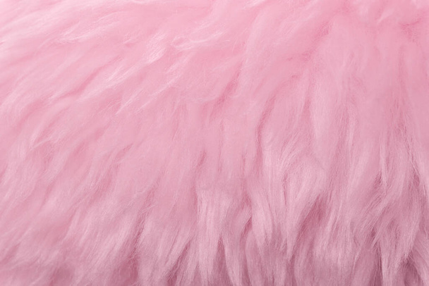 Roze dierlijke wol textuur achtergrond. Rosy tint natuurlijke wol. Close-up textuur van pluche pluizig bont - Foto, afbeelding