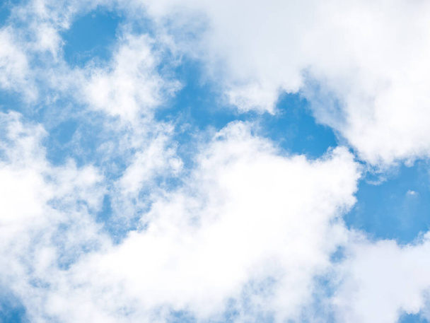 White clouds on a blue sky background. - Foto, Bild