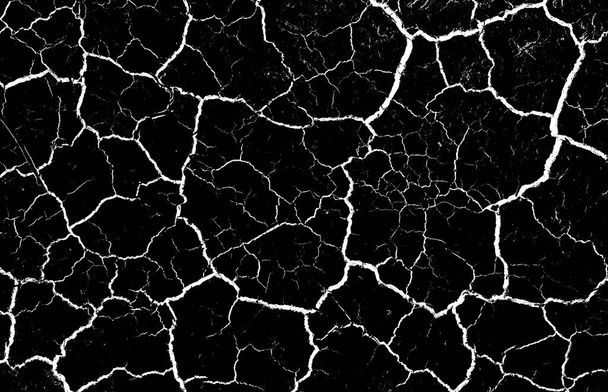 Black dried and cracked ground earth background. Closeup of dry fissure dark ground. crack on surface texture. erosion - Photo, Image