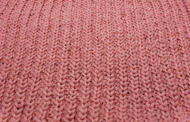 Textura de un suéter de punto rosa de cerca, lana de punto rojo - Foto, Imagen