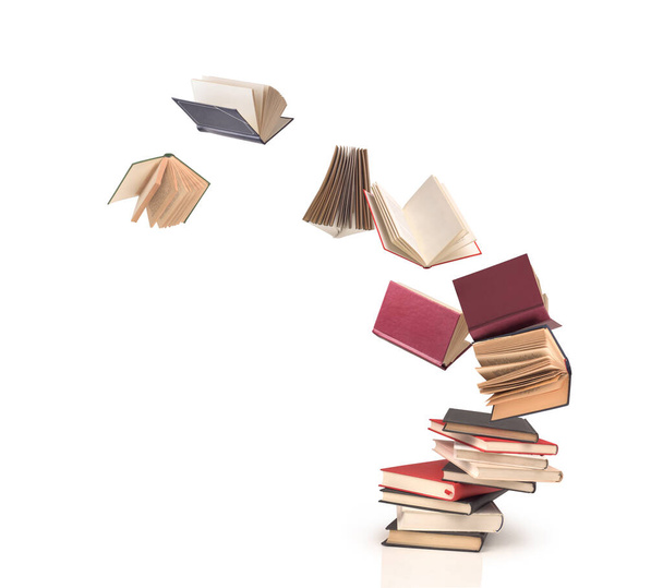 flying open books out off stack isolated - Foto, Imagem