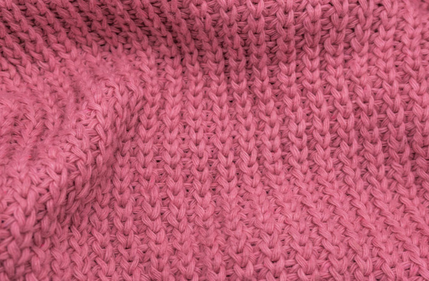 Texture d'un pull tricoté rose gros plan, laine tricotée rouge - Photo, image