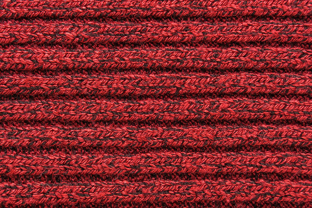 Texture d'un pull tricoté rouge en gros plan. matériel de laine tricotée - Photo, image