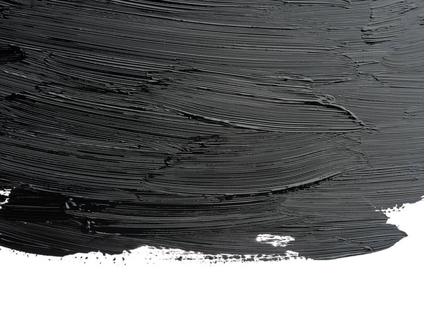 swatch of black smudged acrylic paint isolated on white background, close up - Photo, image