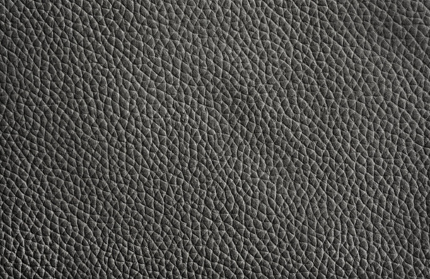 Black natural leather close-up background, gray leather texture, grey background texture with pattern - Photo, Image