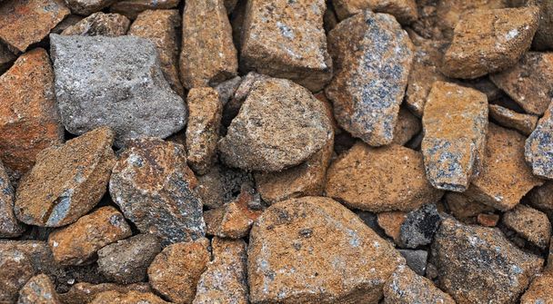 Štěrkové kameny v písku pozadí - Fotografie, Obrázek