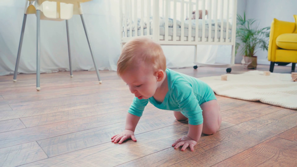 infant boy crawling on floor in living room  - Footage, Video