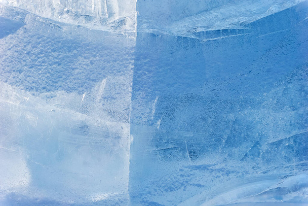 パターンと亀裂の背景を持つ青い氷のテクスチャ、氷の凍結リンク冬の背景、デザイナーのための氷の表面のテクスチャ、ブロック凍結水 - 写真・画像