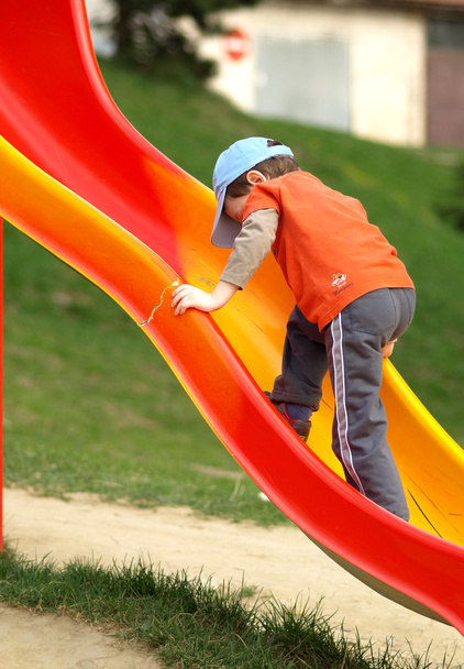 Boy on the big slides - Foto, afbeelding