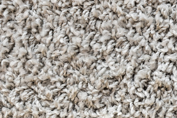 Textura de fondo de alfombra blanca, primer plano, textura textil gris, fondo de alfombra esponjosa, textura de tela de lana, alfombra peluda beige, alfombra peluda de fragmento, interior - Foto, Imagen
