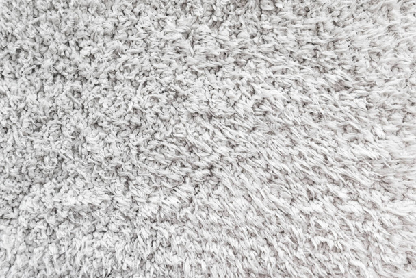 White wool texture background,  light natural sheep wool, texture of white fluffy fur, fragment  wool carpet, gray mat, white rug - Foto, immagini