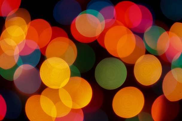 Abstract colorful defocused circular facula. Bokeh blurred color light can use background. new year bokeh defocus - Фото, изображение