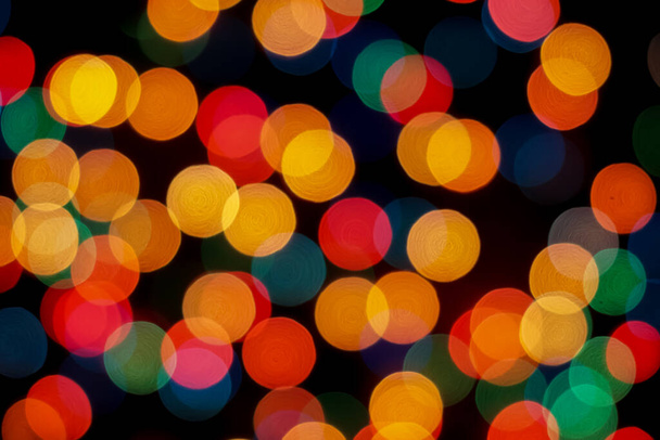 Abstract colorful defocused circular facula. Bokeh blurred color light can use background. new year bokeh defocus - Foto, Imagen