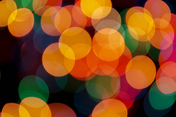 Abstract colorful defocused circular facula. Bokeh blurred color light can use background. new year bokeh defocus - Foto, imagen