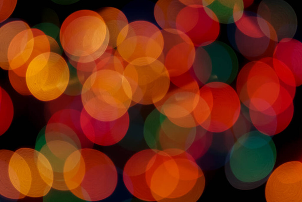 Abstract colorful defocused circular facula. Bokeh blurred color light can use background. new year bokeh defocus - Foto, afbeelding