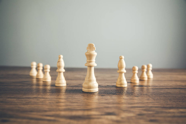 white chess on the wooden table background - Φωτογραφία, εικόνα