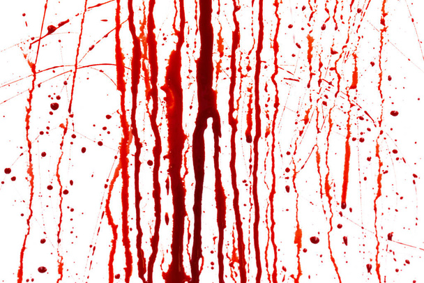 Dripping blood isolated on white background. Flowing red blood splashes, drops and trail - Photo, Image