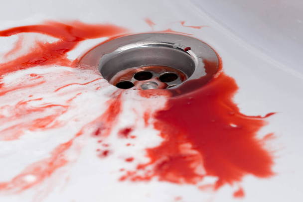 Flowing blood in the sink. Murder concept background - Fotoğraf, Görsel