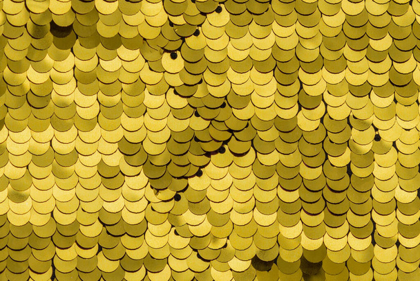 Текстура жовтих паєток з шовковим фоном
 - Фото, зображення