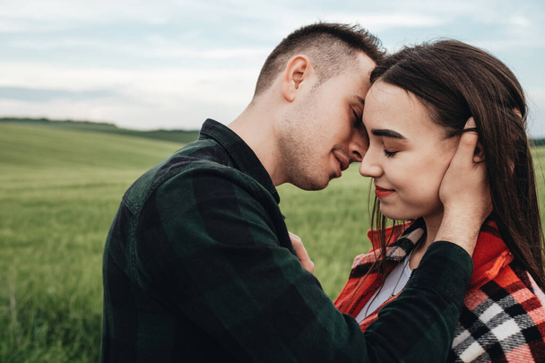 Young Beautiful Couple Hugging Outdoors in Field - Photo, Image