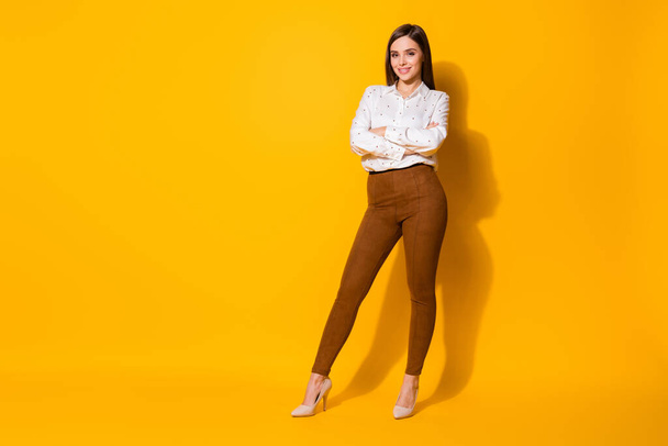 Full length body size view of her she nice-looking attractive lovely pretty fashionable cheerful cheery straight-haired girl folded arms isolated bright vivid shine vibrant yellow color background - Fotoğraf, Görsel