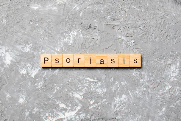 Psoriasis word written on wood block. Psoriasis text on table, concept. - Photo, Image