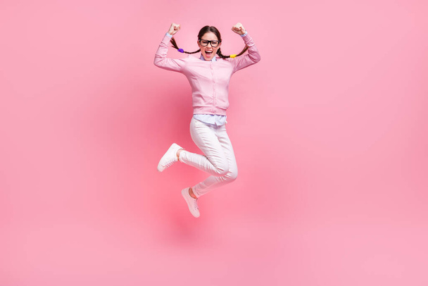 Full length body size view of her she nice attractive overjoyed satisfied crazy lucky cheerful cheery glad teen girl jumping rejoicing having fun attainment isolated pink pastel color background - Valokuva, kuva