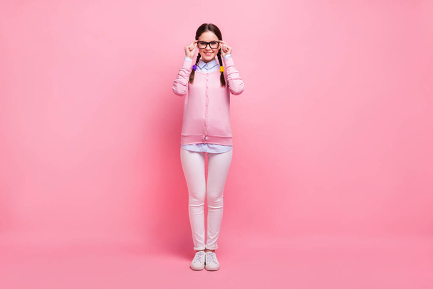Full length body size view of her she nice attractive lovely pretty cute smart clever cheerful cheery girl geek wearing touching specs isolated over pink pastel color background - Photo, Image