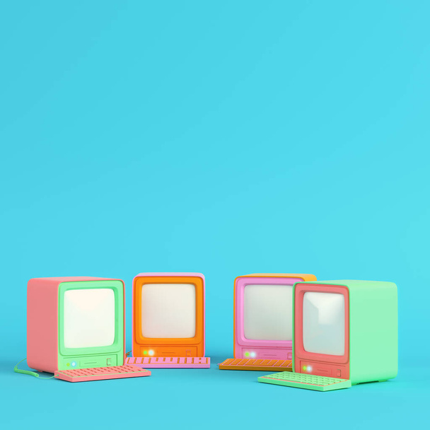 Colorful retro computers on bright blue background in pastel colors. Minimalism concept. 3d render - Photo, Image