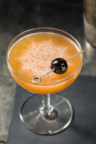 Boozy Blood and Sand Cocktail with a Cherry Garnish - Zdjęcie, obraz