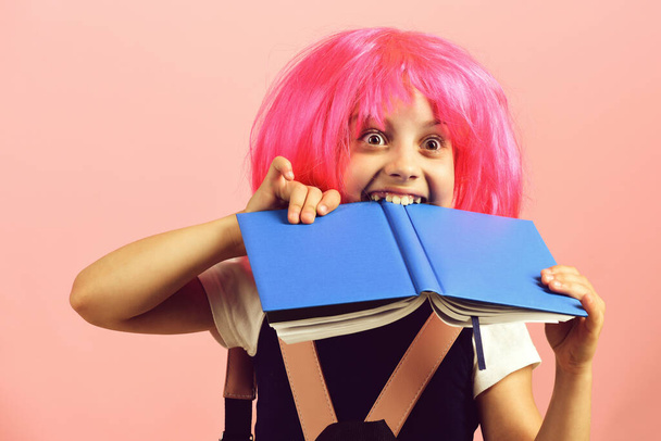 School girl with surprised sight isolated on pink background - Φωτογραφία, εικόνα