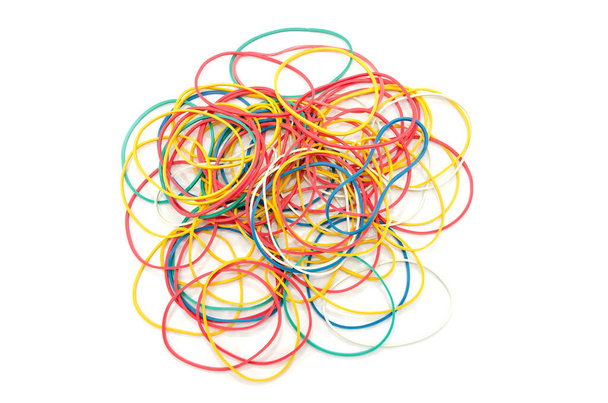 stationery colored rubber bands isolated on white. View from above. Lots of rubber bands - Photo, Image