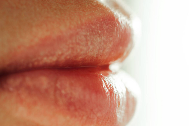 female big sensual lips on a white background close-up woman without makeup - Foto, Bild