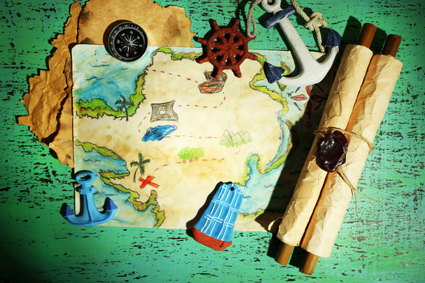 Treasure map with sea accessories, on wooden background - Фото, зображення