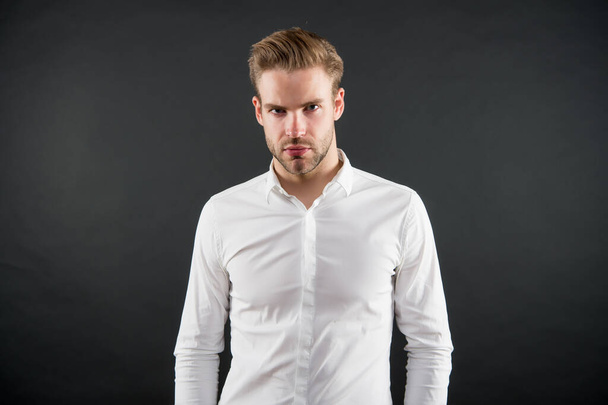 Handsome young man wear classy white shirt grey background, fashion - Фото, зображення