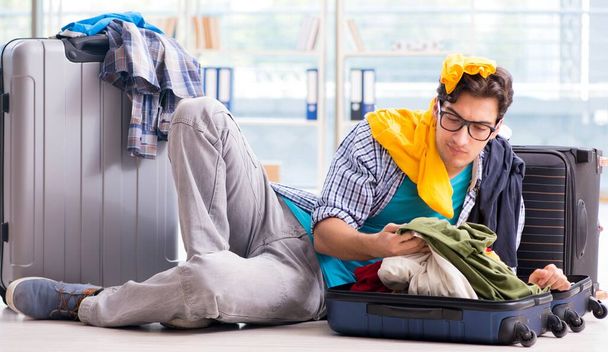 Young man preparing for vacation travel - Photo, Image