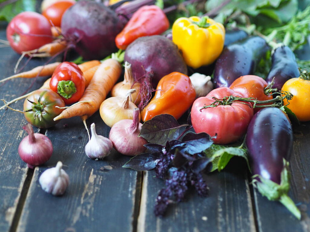 Fresh organic vegetables from garden on a rustic wooden background.Healthy food concept - Fotoğraf, Görsel