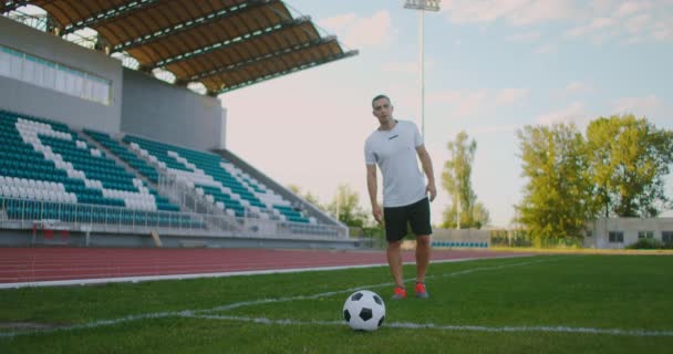 Soccer player performs outstanding play during a soccer game on a professional outdoor soccer stadium. Player wears unbranded uniform. Stadium and  - Footage, Video