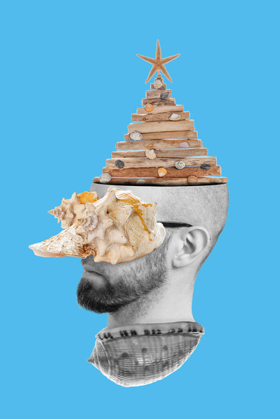 Collage of modern art. A man's head peeking out of a seashell, with a seashell on his eyes and a Christmas tree on his head. Blue background. - Photo, Image