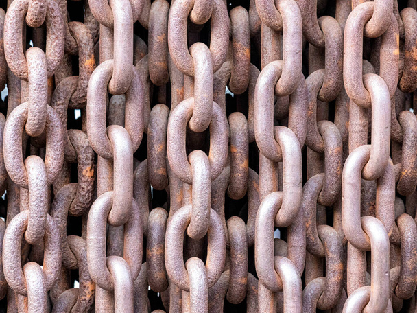 Old rusty chains illustrating a concept of terror and iron curtain - Fotó, kép