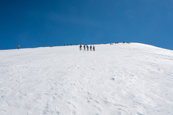 Cervinia, Italy - July 18, 2020: Mountaineers ascending and tackling slopes of Breithorn - considered to be the easiest 4000m peak in Alps - 写真・画像