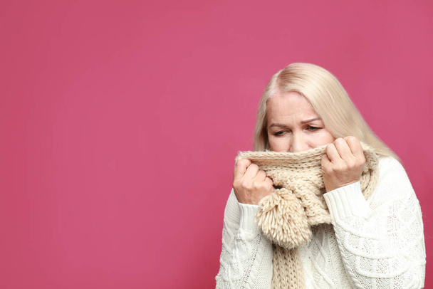 Mature woman coughing on pink background, space for text. Cold symptoms - Φωτογραφία, εικόνα