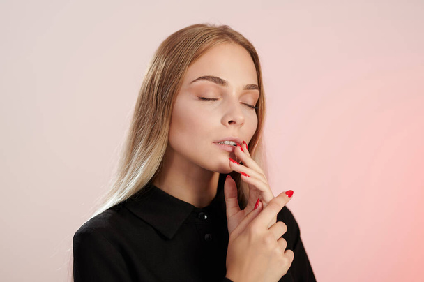 Calm portrait of young woman with closed eyes isolated on pink background - Φωτογραφία, εικόνα