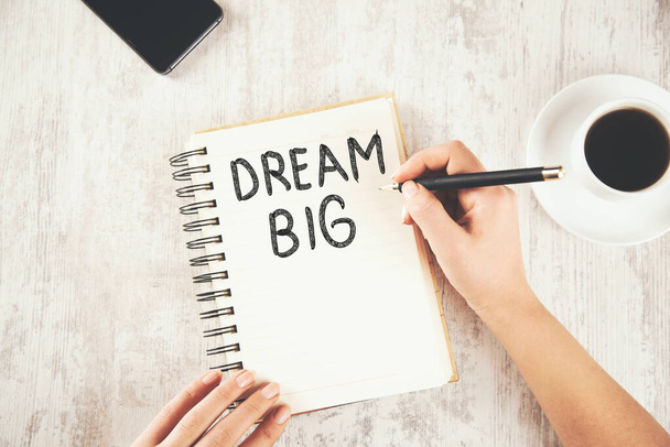woman written dream big text on notepad - Φωτογραφία, εικόνα