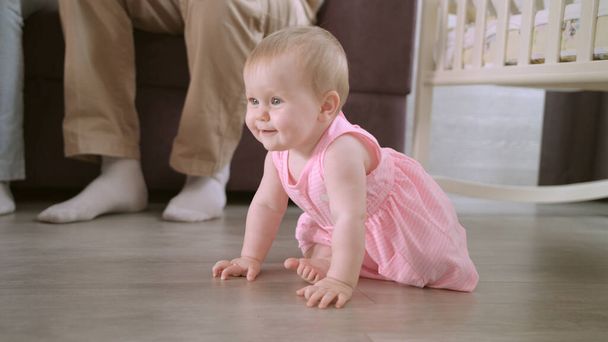 Baby crawling on floor at home. Sweet childhood. Toddler walking in home - Zdjęcie, obraz