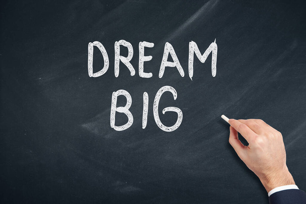 man written dream big text on chalkboard - Φωτογραφία, εικόνα